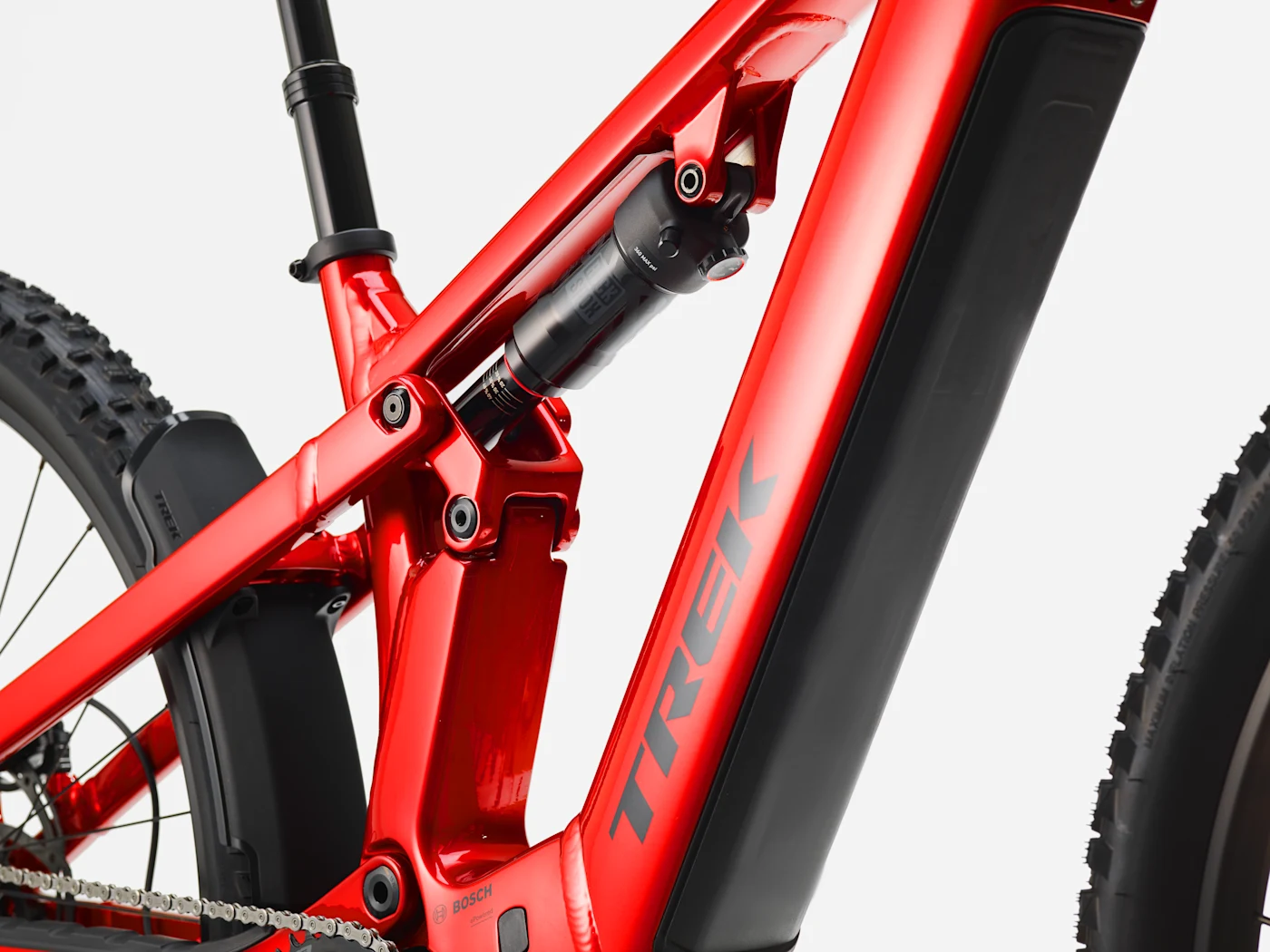 Trek Powerfly+ FS 4 800 Gen 4: rear suspension and frame detail, shown in Fury Red / Dark Star.