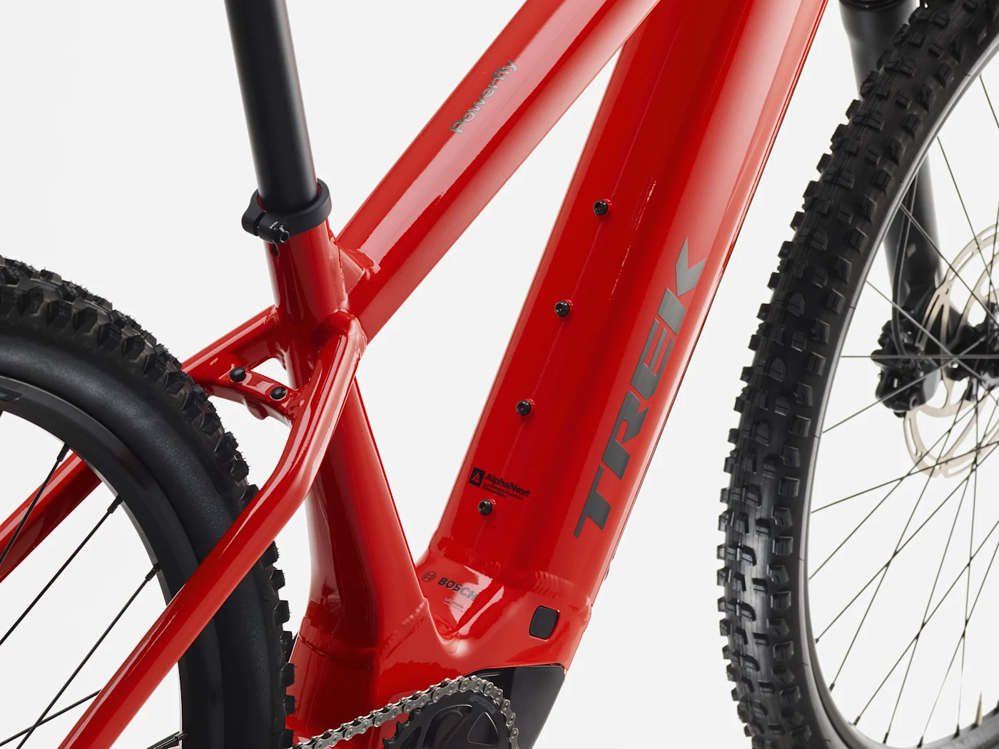 Trek Powerfly+ 4 800Wh Gen 5: battery cover and frame detail, shown in Radioactive Red / Black Chrome.